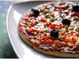 Recette Pizza aux poivrons, jambon, fromage et olives