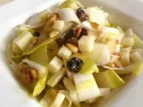 Recette Salade d'endives aux pignons, raisins secs, ossau iraty & miel