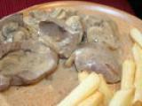 Recette Rognons de porc au vin blanc, moutarde et champignons, flambés au cognac