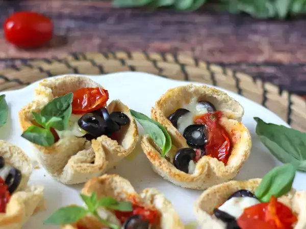 Recette Nids de pain à la mozzarella, tomates et olives