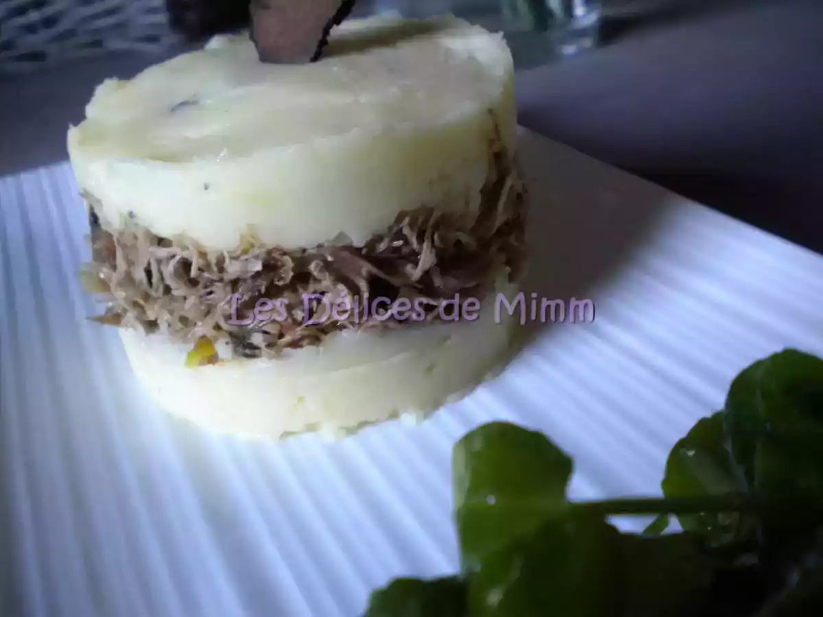 Canard confit en Parmentier à la purée truffée