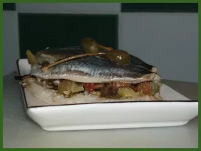 Papillote de sardines aux légumes confits à l'huile et aux câpres