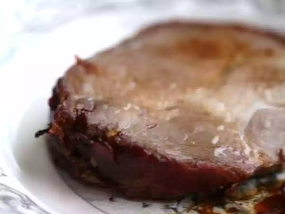 Rôti de porc enrobé de poitrine fumée et gratin de courge spaghetti aux noix